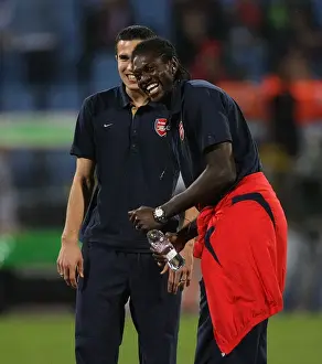 Robin van Persie and Emmanuel Adebayor (Arsenal) share a joke before the match