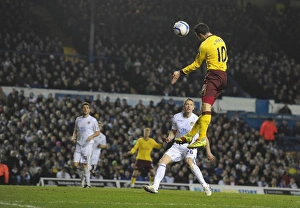 Leeds United v Arsenal FA Cup 2010-11 Collection: Robin van Persie heads past Leeds goalkeeper Kasper Schmeichel to score the 3rd Arsenal goal
