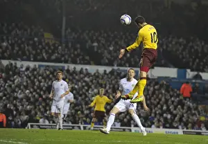 Robin van Persie heads past Leeds goalkeeper Kasper Schmeichel to score the 3rd Arsenal goal
