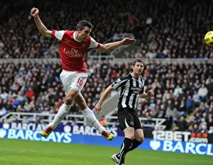 Robin van Persie heads past Newcastle goalkeeper Steve Harper to score the 4th Arsenal goal