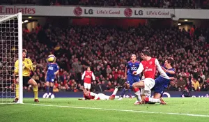 Robin van Persie scores Arsenals 1st goal pass Edwin van der Sar and under pressure from Gary Neville (Man Utd). Arsenal 2: 1 Manchester United. FA Premiership. Emirates Stadium, 21 / 1 / 07. Credit: Arsenal Football Club /