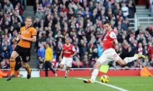 Images Dated 12th February 2011: Robin van Persie scores his and Arsenals 2nd goal under pressure from Christophe Berra