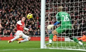 Arsenal v Wigan Athletic 2010-11 Collection: Robin van Persie scores his and Arsenals 2nd goal past Ali Al Habsi (Wigan)