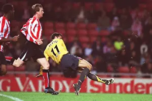 Robin van Persie scores Arsenals 3rd goal his 2nd under pressure from Steven Caldwell