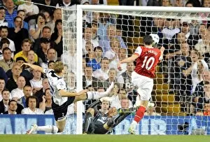 Images Dated 20th April 2011: Robin van Persie scores Arsenals 3rd goal past Heurelho Gomes and Michael Dawson