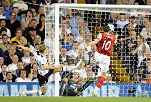 Robin van Persie scores Arsenals 3rd goal past Heurelho Gomes and Michael Dawson