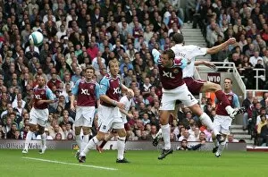 Images Dated 1st October 2007: Robin van Persie scores Arsenals goal under pressure from Lucas Neill (West Ham)