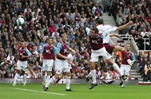 Robin van Persie scores Arsenals goal under pressure from Lucas Neill (West Ham)
