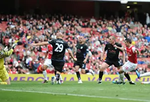 Arsenal V Aston Villa 2010-11 Prints: Robin van Persie shoots past Aston Villa goalkeeper Brad Friedel to score the Arsenal goal