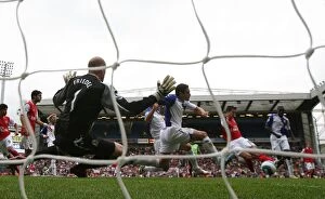 Images Dated 19th August 2007: Robin van Persie shoots past Blackburn goalkeeper Brad Friedel to score the Arsenal goal