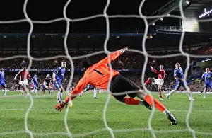 Robin van Persie shoots past Chelsea goalkeeper Petr