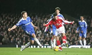 Chelsea v Arsenal 2008-09 Collection: Robin van Persie shoots past Frank Lampard to score