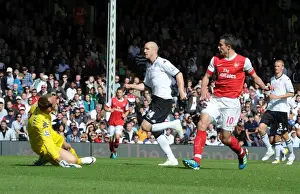 Fulham V Arsenal 2010-11 Prints: Robin van Persie shoots past Fulham goalkeeper Mark Schwarzer to score the 1st Arsenal goal