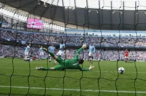 Robin van Persie shoots past Man City goalkeeper Shay