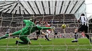 Images Dated 5th February 2011: Robin van Persie shoots past Newcastle goalkeeper Steve Harper to score the 3rd Arsenal goal