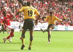 Robin van Persie shoots past Scott Carson to score the 1st Arsenal goal
