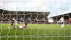West Ham United V Arsenal 2009-10 Prints: Robin van Persie shoots past West Ham goalkeeper Robert