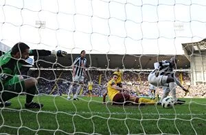 Images Dated 19th March 2011: Robin van Persie taps the ball past WBA goalkeeper Scott Carson to score the 2nd Arsenal goal