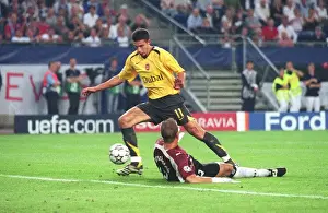 Robin van Persie is tripped by Hamburg goalkeeper Sasha Kirschstein for the Arsenal penalty