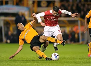 Wolverhampton Wanderers V Arsenal 2011-12 Prints: Robin van Persie vs. Carl Henry: Intense Clash Between Wolverhampton Wanderers and Arsenal