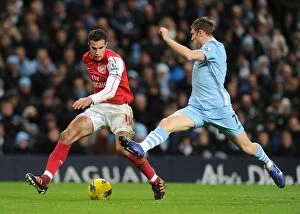 Images Dated 18th December 2011: Robin van Persie vs. James Milner: Clash of the Titans - Manchester City vs