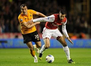Wolverhampton Wanderers v Arsenal 2011-12 Collection: Robin van Persie vs. Nenad Milijas: A Battle at Molineux, Arsenal vs