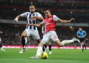 Arsenal v West Bromwich Albion 2011-12 Collection: Robin van Persie vs. Steven Reid: A Battle at Emirates Stadium