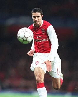 Images Dated 24th November 2006: Robin van Persie's Brilliant Performance: Arsenal's Triumph over Hamburg in the Champions League