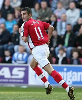 Robin van Persie's Dominance: Arsenal Crush Wigan Athletic 4-1 in Premier League