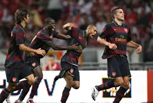 Robin van Persie's Euphoric Goal Celebration with Teammates Eboue, Eduardo, and Clichy: Arsenal's Historic Win at Ajax ArenA (4/8/07)