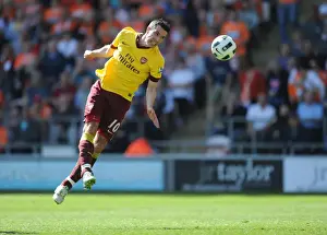 Robin van Persie's Hat-Trick: Arsenal's Triumphant 3-1 Victory Over Blackpool in the Premier League
