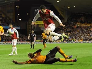 Wolverhampton Wanderers v Arsenal 2011-12 Collection: Robin van Persie's Soaring Past of Ronald Zubar: A Premier League Goal to Remember, Arsenal vs