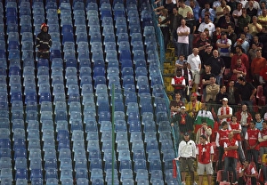Steaua Bucharest v Arsenal 2007-08 Collection: A Rominian Policeman keeps an eye on the Arsenal fans