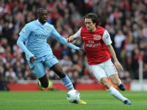 Images Dated 8th April 2012: Rosicky vs. Toure: Clash of Midfield Titans - Arsenal v Manchester City, Premier League, 2011-12