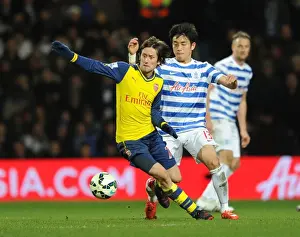 Queens Park Rangers V Arsenal 2014-15 Prints: Rosicky vs Yun: Clash of the Wings in Queens Park Rangers vs Arsenal