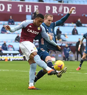 Rrob Holding vs Ezri Konsa: A Battle at Villa Park in Empty Premier League Stadiums (Aston Villa vs Arsenal, 2021)