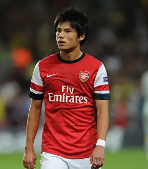 Ryo Miyaichi: Arsenal's Determined Striker in UEFA Champions League Clash Against Fenerbahce (2013-14)