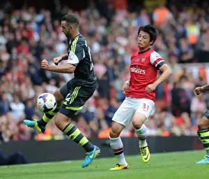Arsenal V Stoke City 2013-14 Prints: Ryo Miyaichi Outmaneuvers Marc Wilson in Arsenal's Victory over Stoke City