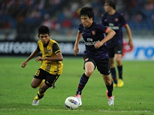 Ryo Miyaichi vs Ahmad Shakir Md Ali: A Football Showdown in the 2012-13 Arsenal Pre-Season Match in Kuala Lumpur