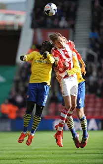 Stoke City V Arsenal 2013-14 Prints: Sagna, Mertesacker and Crouch Clash in Stoke City vs Arsenal Premier League Encounter