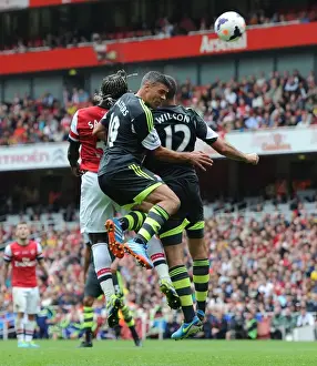 Sagna Scores Third Goal for Arsenal Against Stoke Amidst Pressure from Walters and Wilson