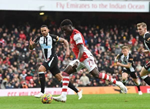 Images Dated 27th November 2021: Saka Scores First: Arsenal's Triumph Over Newcastle United in the Premier League 2021-22