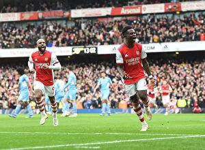 Arsenal v Manchester City 2021-22 Collection: Saka Scores Thrilling Winner: Arsenal Triumphs Over Manchester City in Premier League Showdown