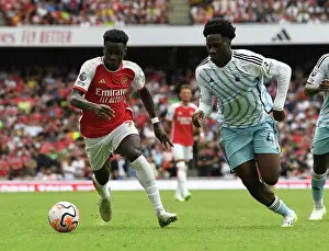 Saka vs. Aina: Intense Face-Off in Arsenal's 2023-24 Premier League Clash Against Nottingham Forest