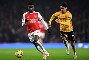 Saka vs. Bueno: A Tense Showdown in Arsenal vs. Wolverhampton Wanderers Premier League Clash, 2023-24