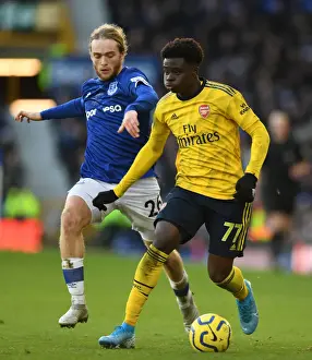 Saka vs. Davies: A Premier League Showdown - Arsenal vs. Everton (December 2019)