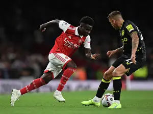 Saka vs. Digne: A Premier League Face-Off at the Emirates (2022-23)