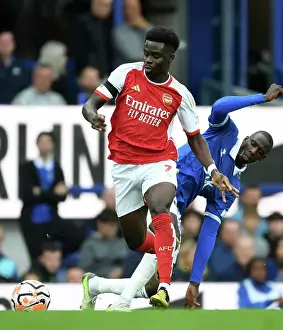 Everton V Arsenal 2023-24 Prints: Saka vs Doucoure: Intense Battle at Goodison Park - Everton vs Arsenal
