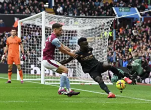 Aston Villa V Arsenal 2022-23 Prints: Saka vs Moreno: A Wing Battle at Villa Park - Intense Showdown between Arsenal's Bukayo Saka
