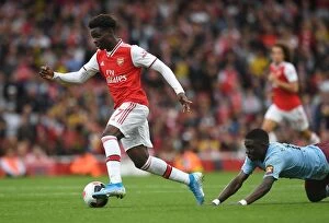 Arsenal v Aston Villa 2019-20 Collection: Saka vs. Nakamba: A Premier League Battle at the Emirates